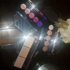 2 eye shadow palettes and a highlight palette